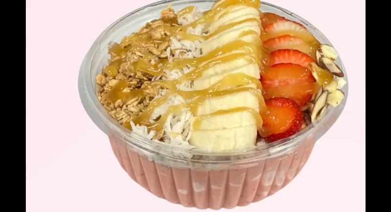 Berry Mango smoothie bowl topped with granola and fresh fruit at Fuel Up Energy Cafe in Bolingbrook, IL