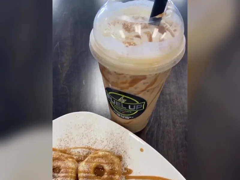A protein coffee with caramel drizzle next to a plate of mini protein donuts at Fuel Up Energy Cafe in Bolingbrook
