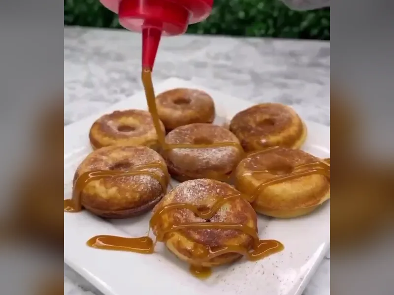 Sugar-free caramel drizzled over a plate of seven baked mini protein donuts from Fuel Up Energy Cafe in Bolingbrook, IL