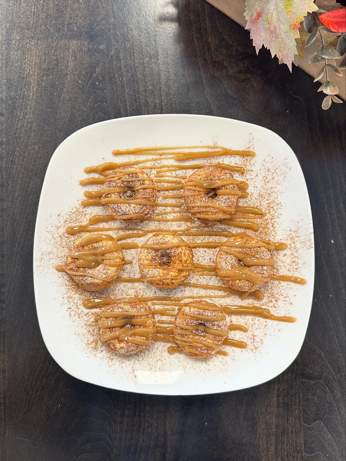 Plate of mini protein donuts drizzled with sugar-free caramel